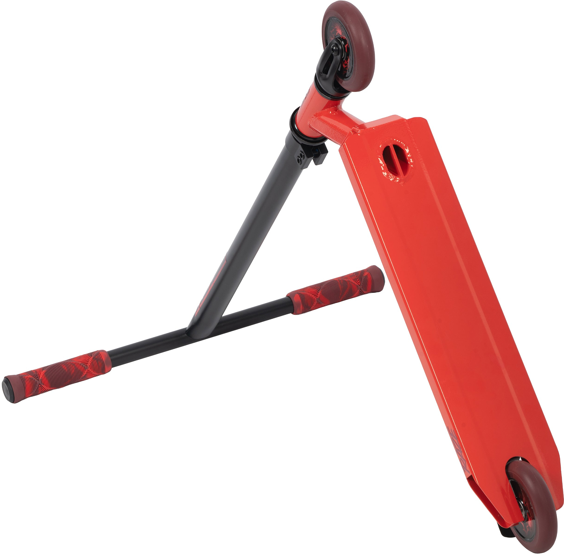 The Legacy Raze Complete Stunt Scooter by Legacy, shown tipped on its side with red handle grips and black/red finish, displays its deck—ideal as an entry-level scooter for aspiring riders.