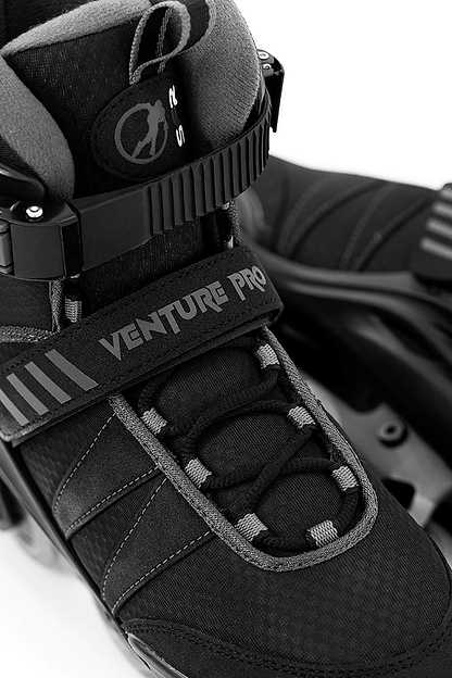 Close-up of black SFR Venture Pro Inline Skates with a durable aluminum frame, robust padding, adjustable straps, and sleek design; paired with ABEC-7 bearings for enhanced durability and comfort.