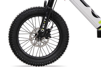 Close-up of the Duo 18" Blitz Kids Electric Balance Bike (White/Black) front fat wheel, with thick treaded tire, disc brake, black fork labeled “BLITZ,” and part of the white frame by Duo.