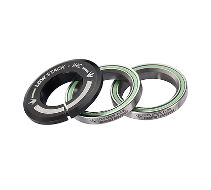 A set of three silver and green sealed bearings for the Blunt Envy Low Stack IHC Integrated Stunt Scooter Headset - Black, along with a black spacer ring labeled "LOW STACK - IHC" designed for compatibility with the IHC Compression System, displayed on a white background.
