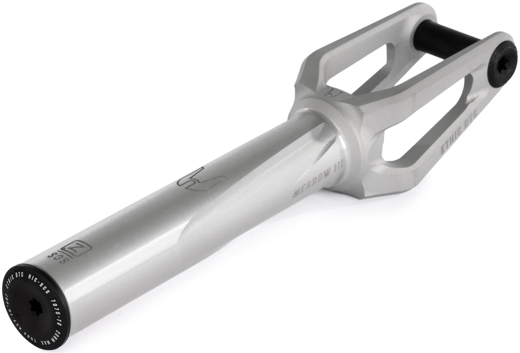 The Ethic DTC Merrow V3 8/12STD SCS Stunt Scooter Forks - Raw is a silver metal fork with a cylindrical base, two angled arms ending in a black axle, and engraved Ethic branding plus a simple logo.