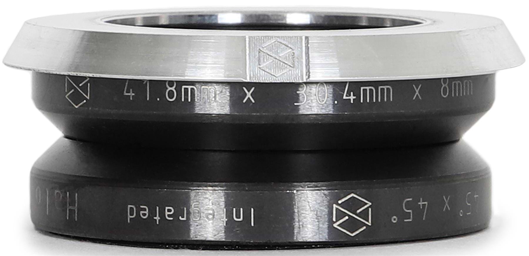 A close-up of the Native Halo Integrated Stunt Scooter Headset - Raw by Native, featuring engraved "41.8mm x 30.4mm x 8mm" measurements, a geometric logo, black body with silver top edge, and SCS setup compatibility.