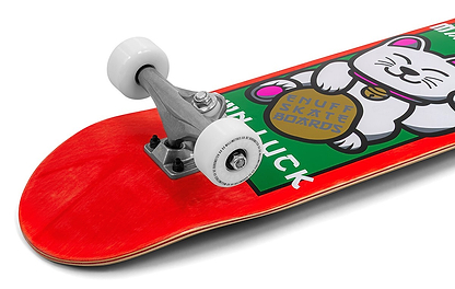 A close-up of the Enuff Lucky Cat Mini Red Complete Skateboard (7.25" x 29.5") by Enuff, a beginner kids’ board with white wheels and a deck featuring a lucky cat holding a gold coin and the words “ENUFF SKATE BOARDS” and “LUCK.”.