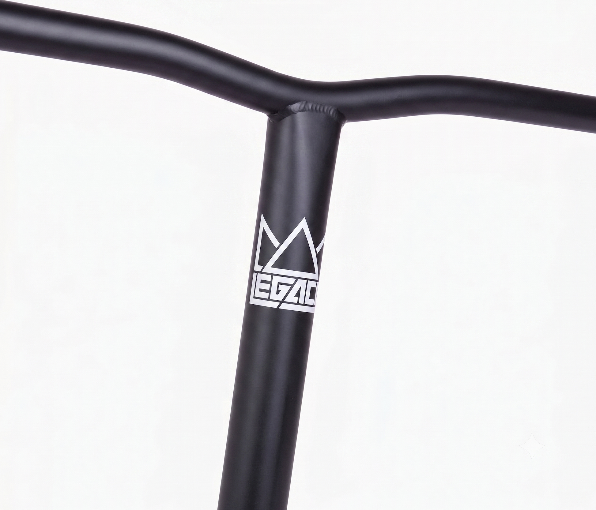 Close-up of Legacy Chromo Lite Steel Oversized HIC/SCS Stunt Scooter Bars in matte black (680mm x 610mm), featuring a white "Legacy" logo with stylized crown on the front. Made from durable chromoly steel; compatible with HIC/SCS setups. Plain white background.