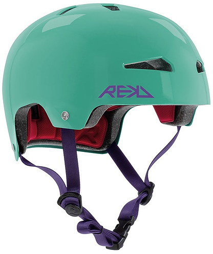 The REKD Elite 2.0 Skate / Scooter Helmet in gloss teal features a purple REKD logo, dark purple adjustable straps, and red interior padding. Lightweight, certified, and comfortable—perfect for safe cycling or skating adventures.