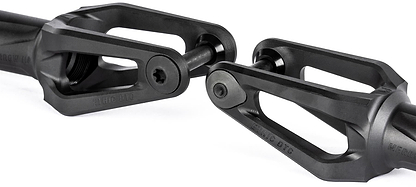 Close-up of two Ethic DTC Merrow V3 8/12STD SCS Stunt Scooter Forks in black, featuring open triangular designs and central bolts, positioned facing each other against a white background.