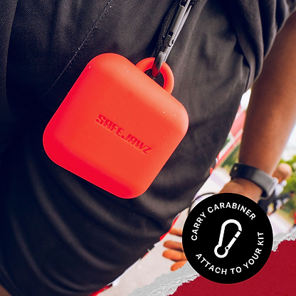 A Safejawz Premium Silicone Mouthguard Case in red, featuring a carabiner, is attached to a bag or belt. A circular label says: “CARRY CARABINER ATTACH TO YOUR KIT” with a carabiner icon—ideal for your breathable Safejawz case.