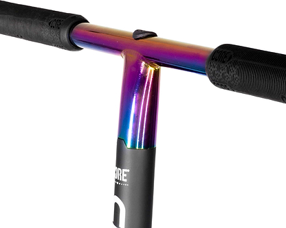 Close-up of the handlebar on the CORE CD1 Complete Stunt Scooter - Neochrome / Black by CORE, featuring black rubber grips and a colorful neochrome finish, attached to a black scooter stem.