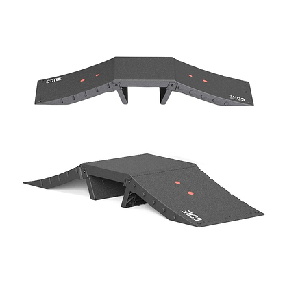 Two views of the CORE Mini Funbox Ramp Set - 2 Kickers & Flat Deck by CORE are shown: the black ramp set with "CORE" and two red dots, featuring a raised center and sloped sides. One image is top-down, the other from a lower angle.