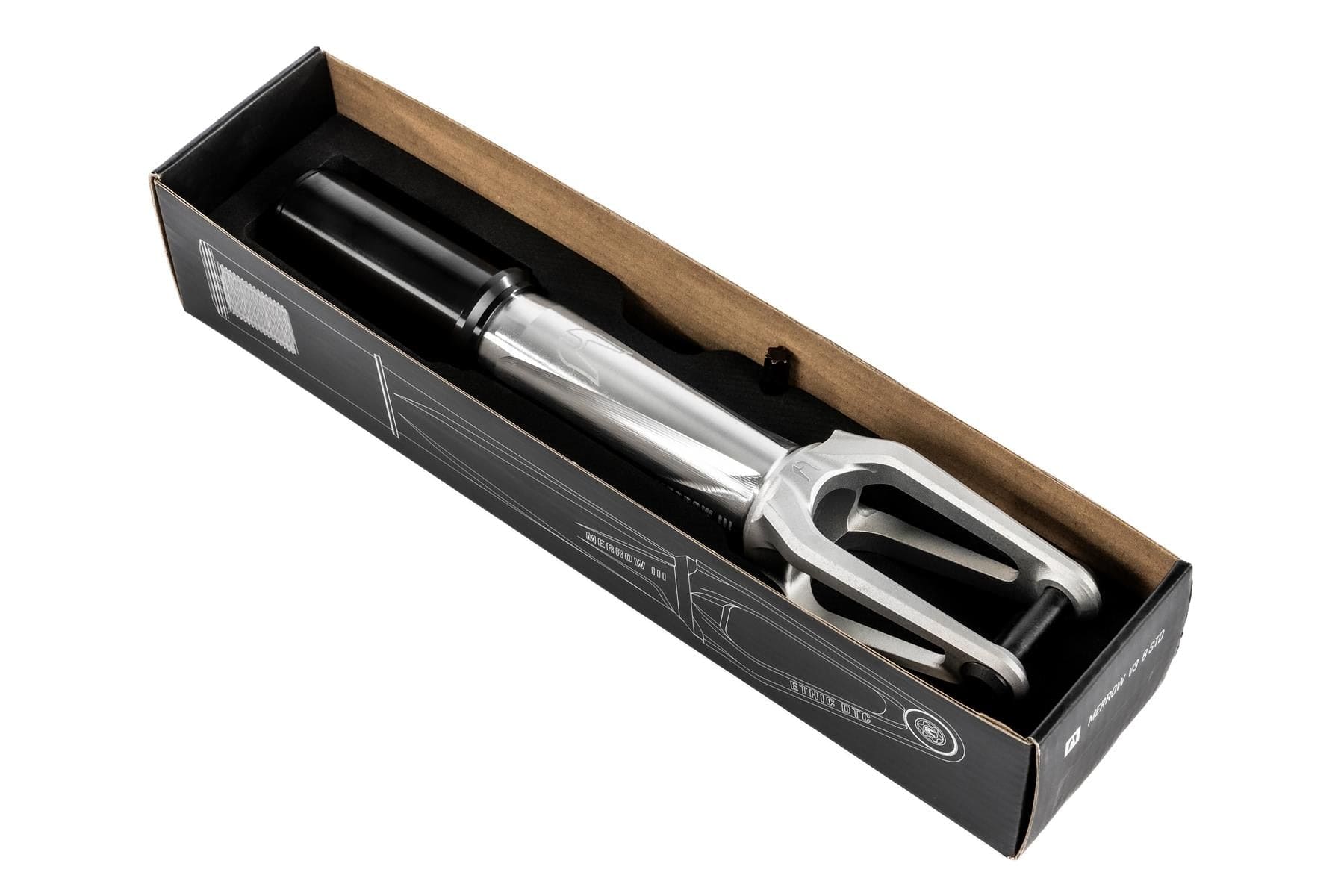 The Ethic DTC Merrow V3 IHC Stunt Scooter Fork in raw silver by Ethic comes in a black box with white line drawings and product details on the packaging.
