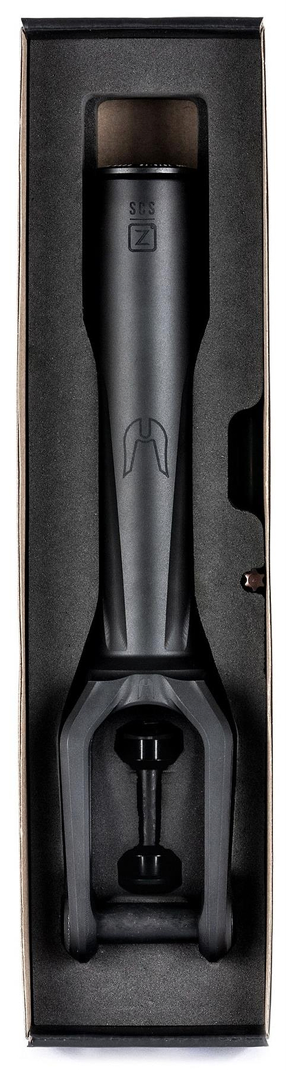 The Ethic DTC Merrow V3 8/12STD SCS Stunt Scooter Forks in black by Ethic come fitted in foam inside a cardboard box, showing the steerer tube and fork crown with engraved logos and markings.