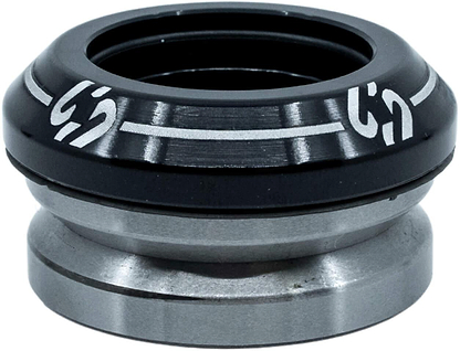 A close-up of the CORE Icon Integrated Stunt Scooter Headset in black, featuring durable bearings and white markings on the top cap, designed by CORE for smooth rotation in stunt scooter steering tube assemblies.