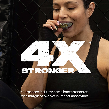 A woman in athletic wear prepares to use the Safejawz Nitro Series Protection Mouthguard - Grey / Yellow. Large text reads "4X STRONGER." Smaller text notes it surpassed industry compliance by over 4x in impact absorption. Brand: Safejawz.
