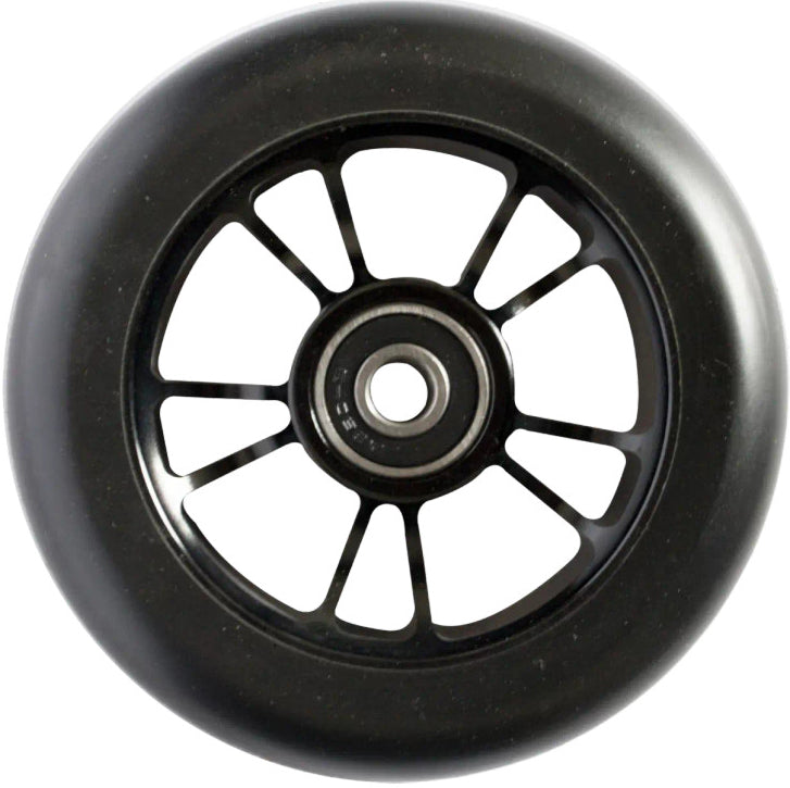 A close-up of the Blunt Envy 100mm Stunt Scooter Wheel in Black/Black, featuring a metal core with multiple spokes and an ABEC 9 bearing, shown against a white background.