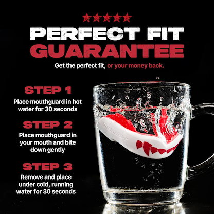 The Safejawz Extro Series Protection Mouthguard - Pink Fangz is shown submerged in water with fitting instructions and bold text: "PERFECT FIT GUARANTEE: Hi-impact protection and the perfect fit, or your money back.