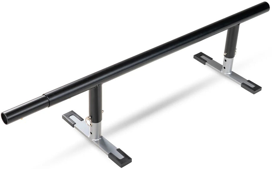 A black metal Madd Gear skate rail with adjustable height and sturdy silver-and-black base legs for skate or inline tricks. Compatible with the Madd Gear MGP Grind Rail Extension Kit - 91cm for added length and challenge.