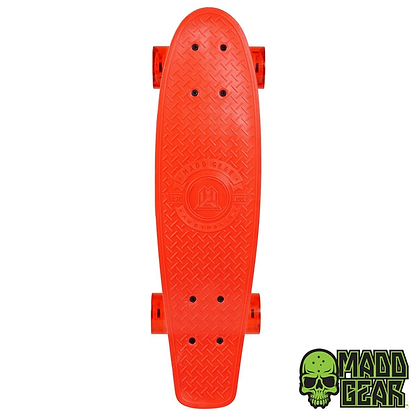 From above, you can see the Madd Gear MGP G-Retro Racer Complete Cruiser - 22.5" x 6.25", featuring a bright orange, retro short board with a textured grip and orange wheels. The Madd Gear (MGP) brand logo with its distinctive green skull design is displayed in the bottom corner. It comes equipped with ABEC 9 bearings for smooth rides.