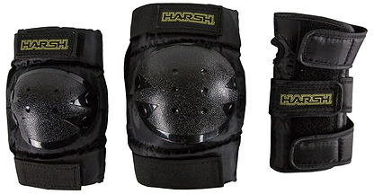 The Harsh Little Shredder 3 Piece Combo Skate Protection Pad Set in black includes two knee pads with shiny hard surfaces and a wrist guard, all featuring the "Harsh Little Shredder" logo. This set is perfect for kids seeking safety and style during their action-packed adventures.