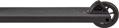 Close-up side view of the Native Stem 495mm S Complete Stunt Scooter by Native in black, featuring a textured deck, geometric logo, and a single rear wheel secured with a black plastic fender.