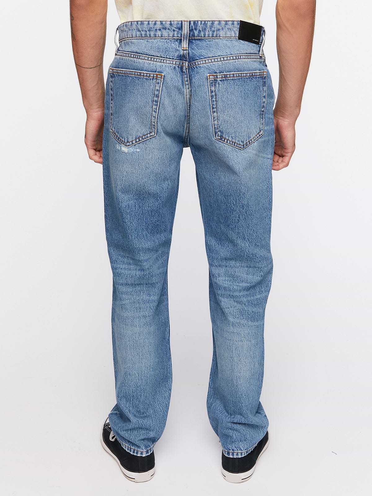 מכנסי ג'ינס עם שפשופים