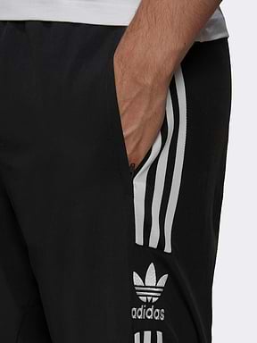 מכנסי ניילון ספורטיביים עם לוגו רקום