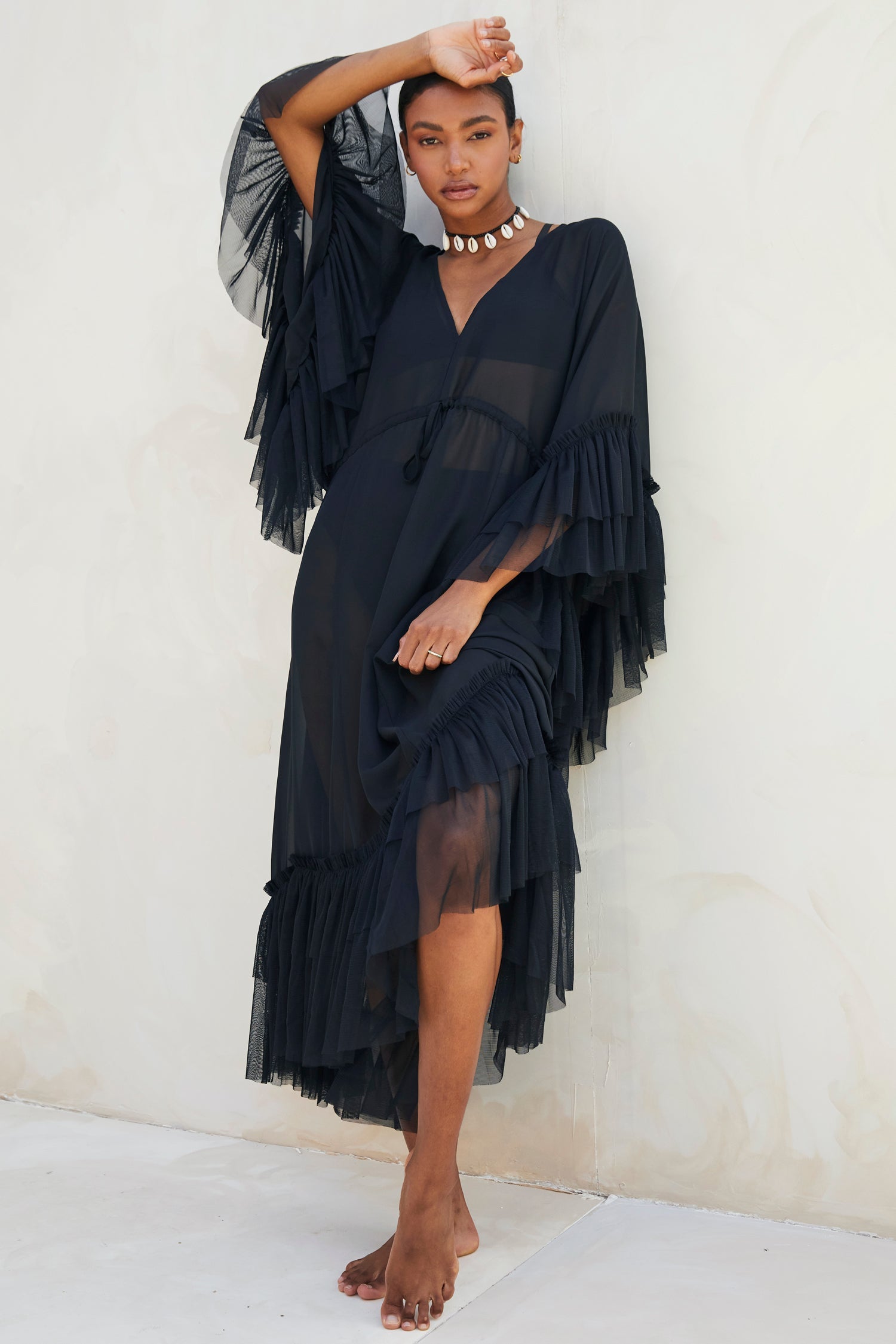 Model wearing Black Sloane Dress standing facing the camera 