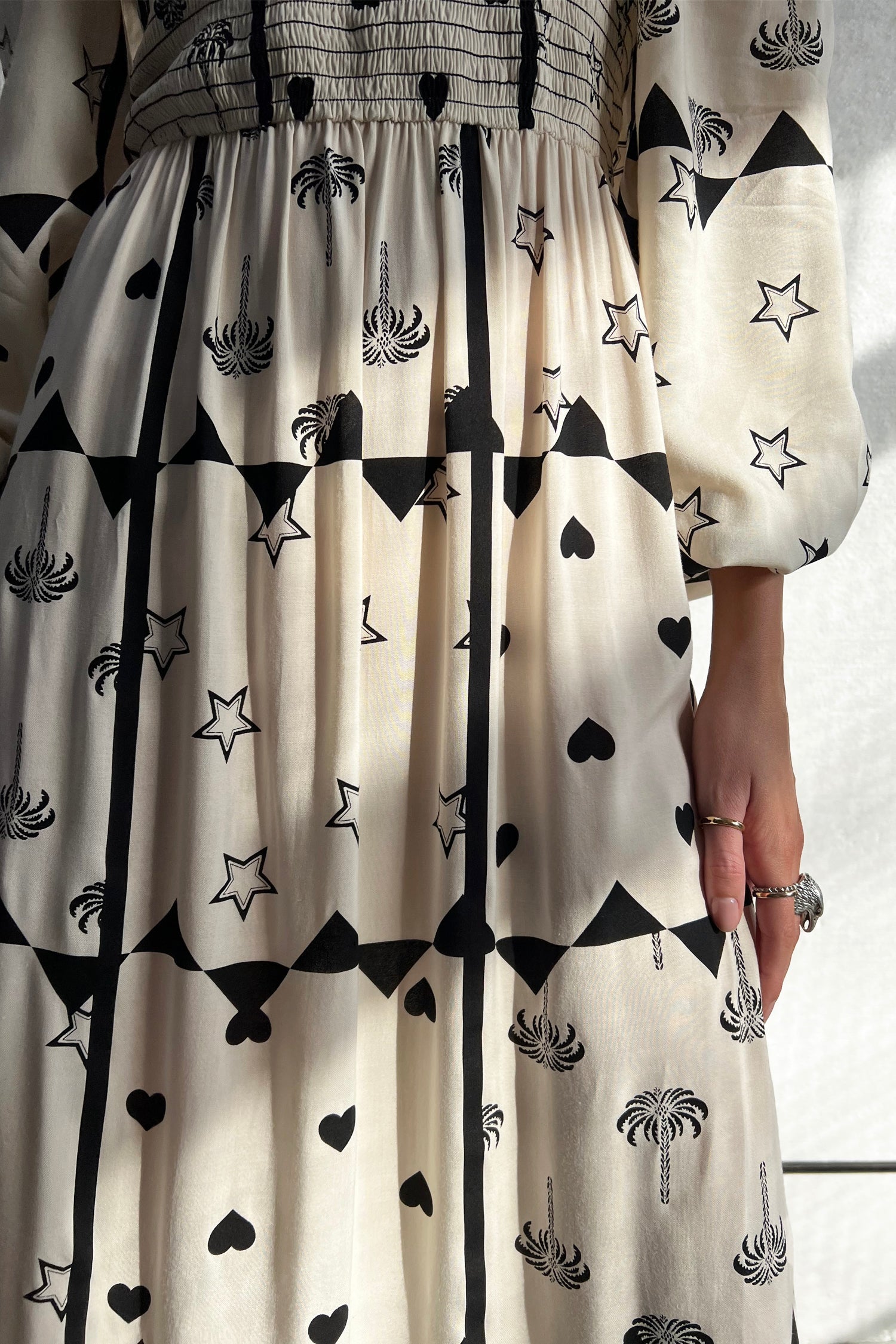 Model wearing Mono Palm Jasmine Dress standing facing the camera 