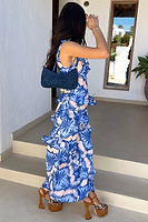 Thumbnail for model looking away from the camera wearing the Blue Palm Faro Maxi Dress