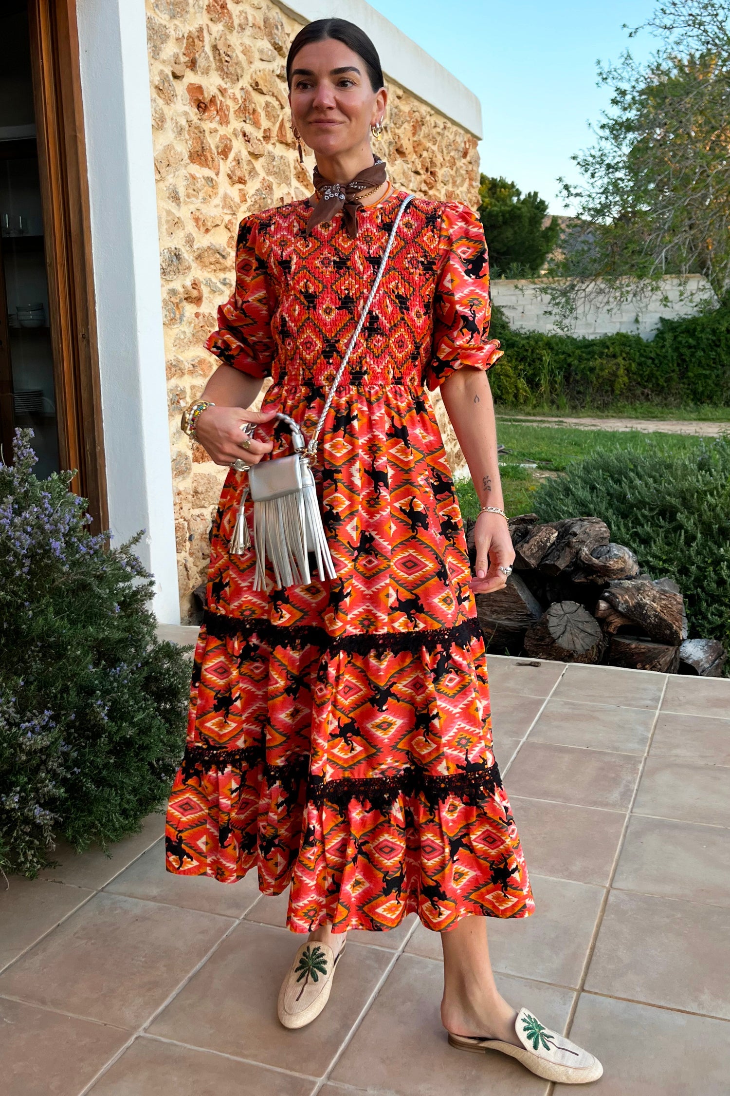 Model wearing Red Rodeo Midi Dress standing facing the camera