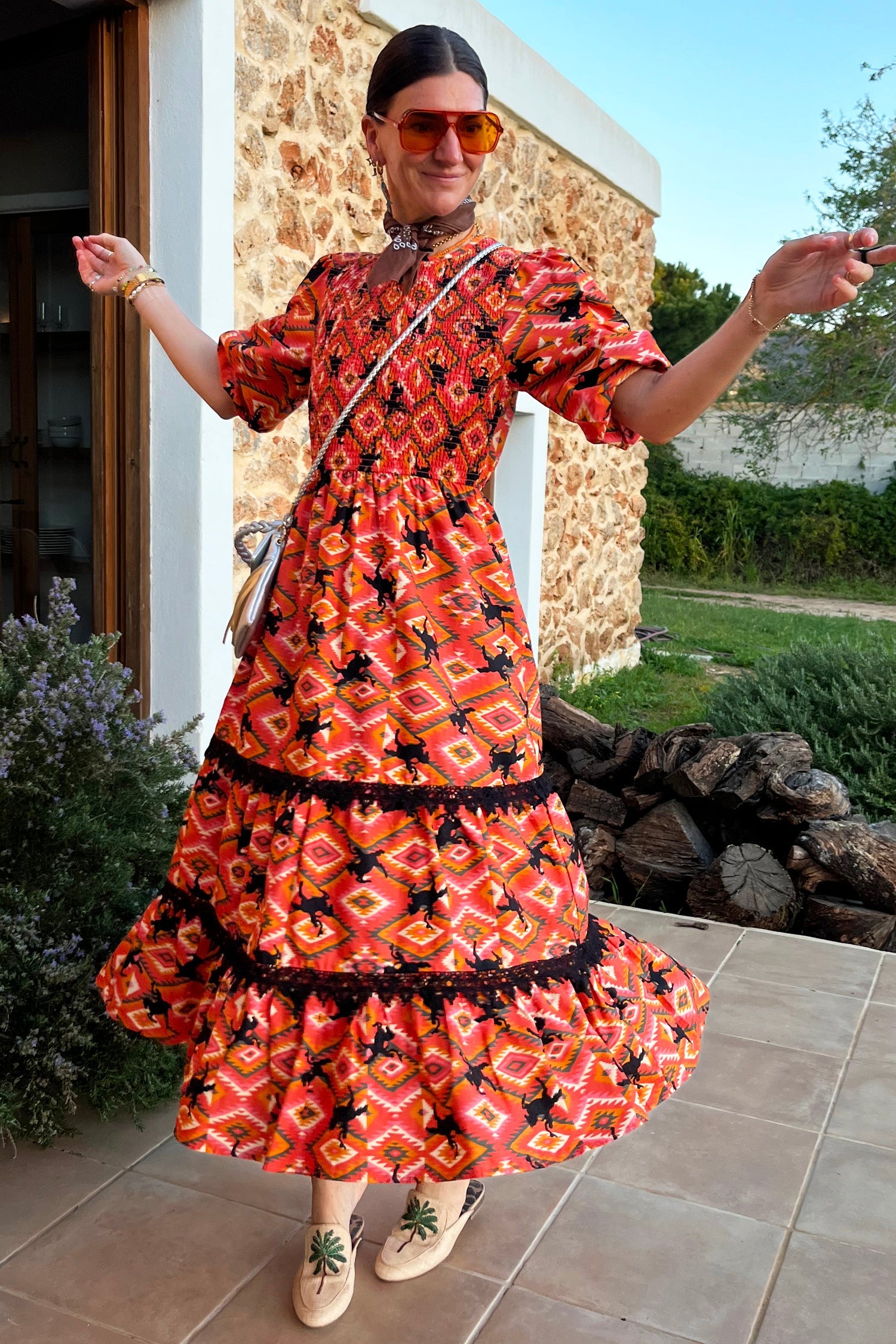 Model wearing Red Rodeo Midi Dress standing facing the camera