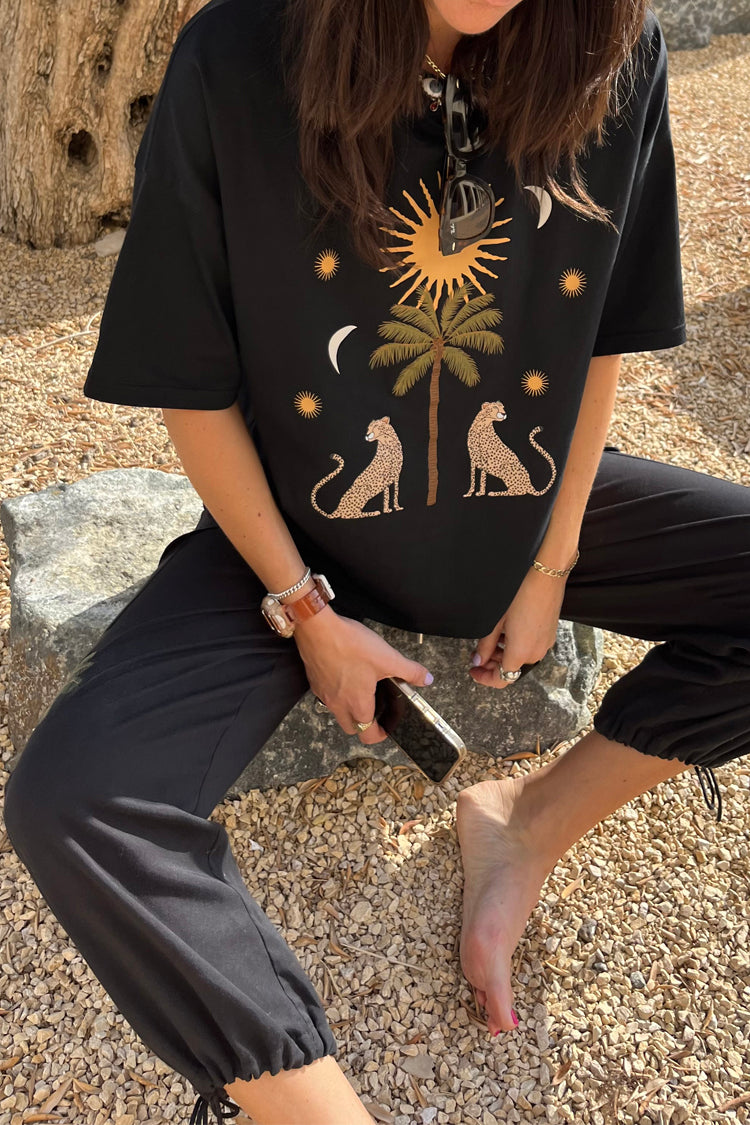caption_Model wears Running Wild T-Shirt in S