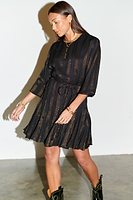Thumbnail for Model wearing Black And Gold Riri Dress