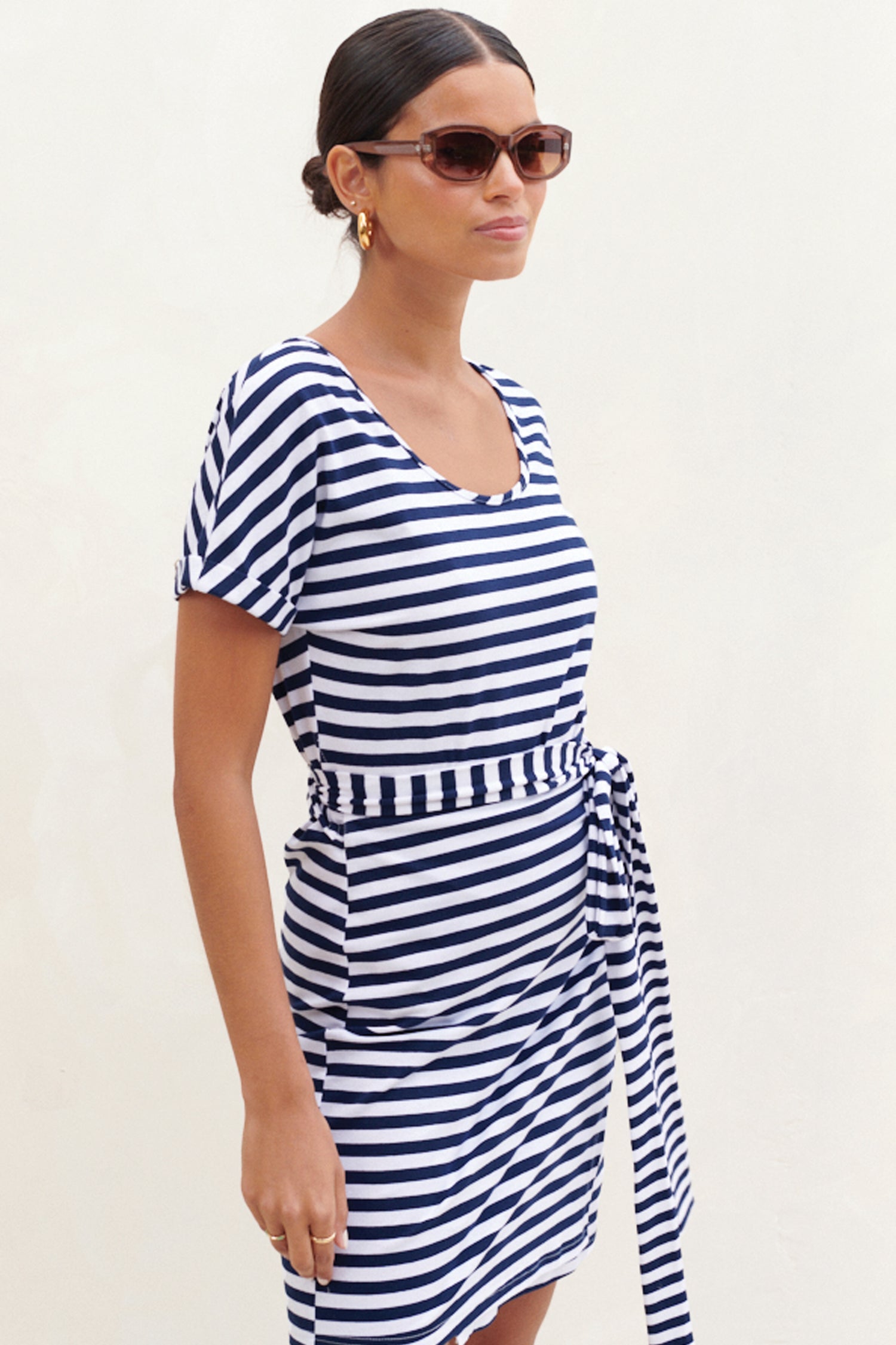 Model wearing Stripe Jersey Wrap Dress side on
