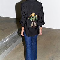 Thumbnail for caption_Model wears Black Running Wilder Miley Shirt in UK size 10/ US 6