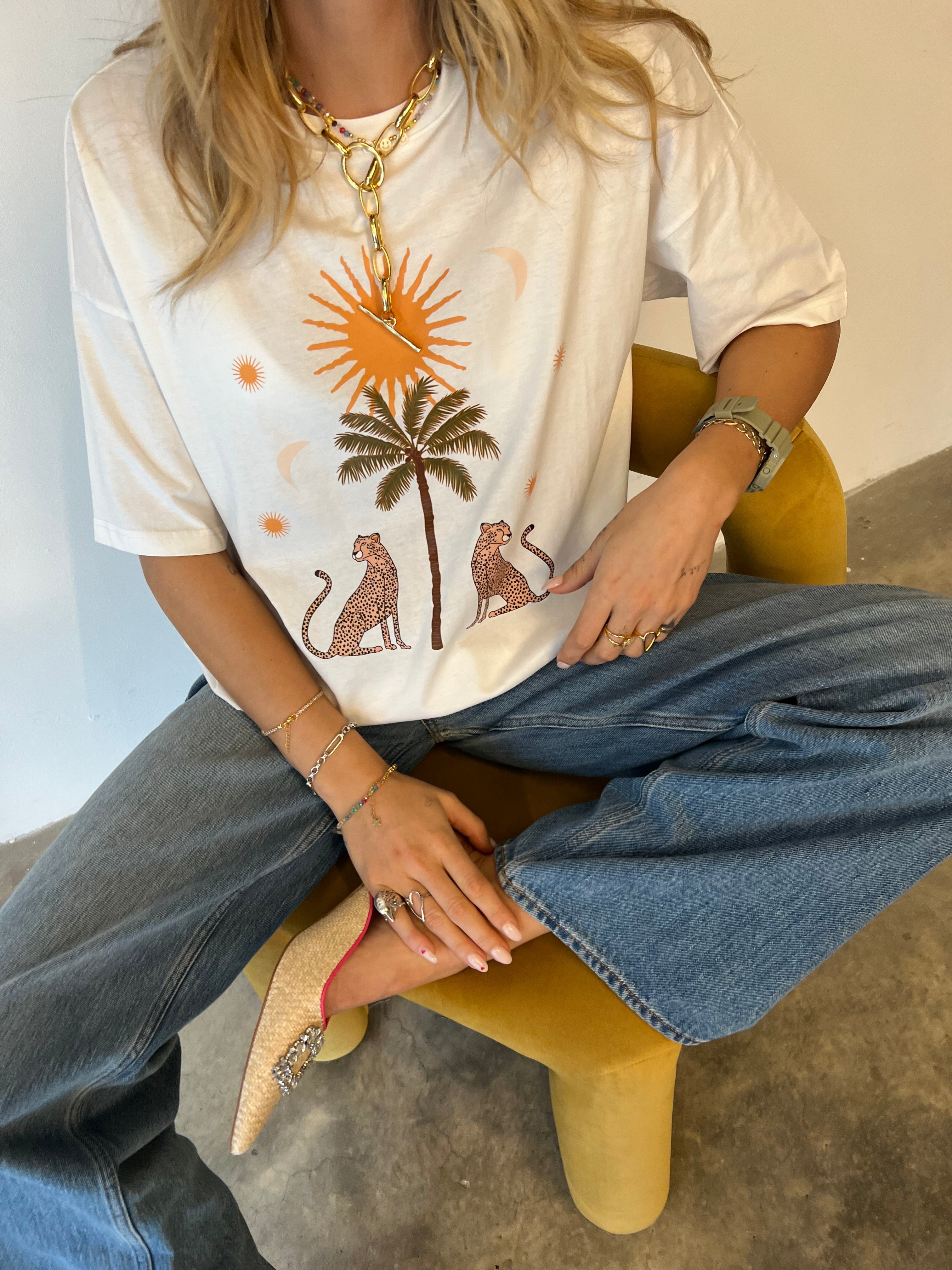 Model wearing White Running Wild T-Shirt facing the camera