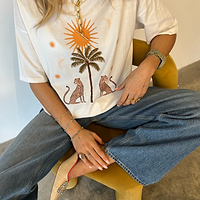 Thumbnail for Model wearing White Running Wild T-Shirt facing the camera