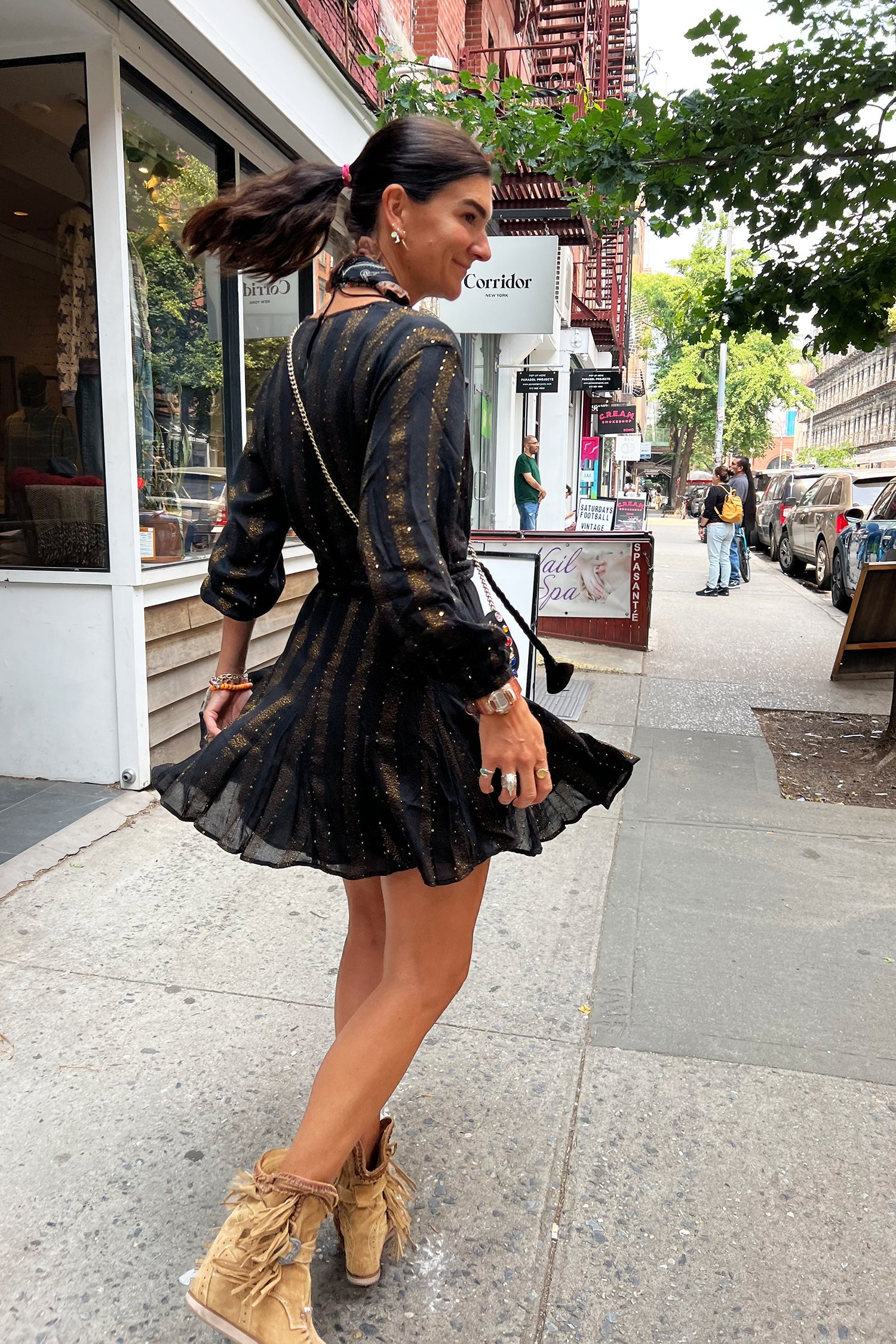 Model wearing Black And Gold Riri Dress