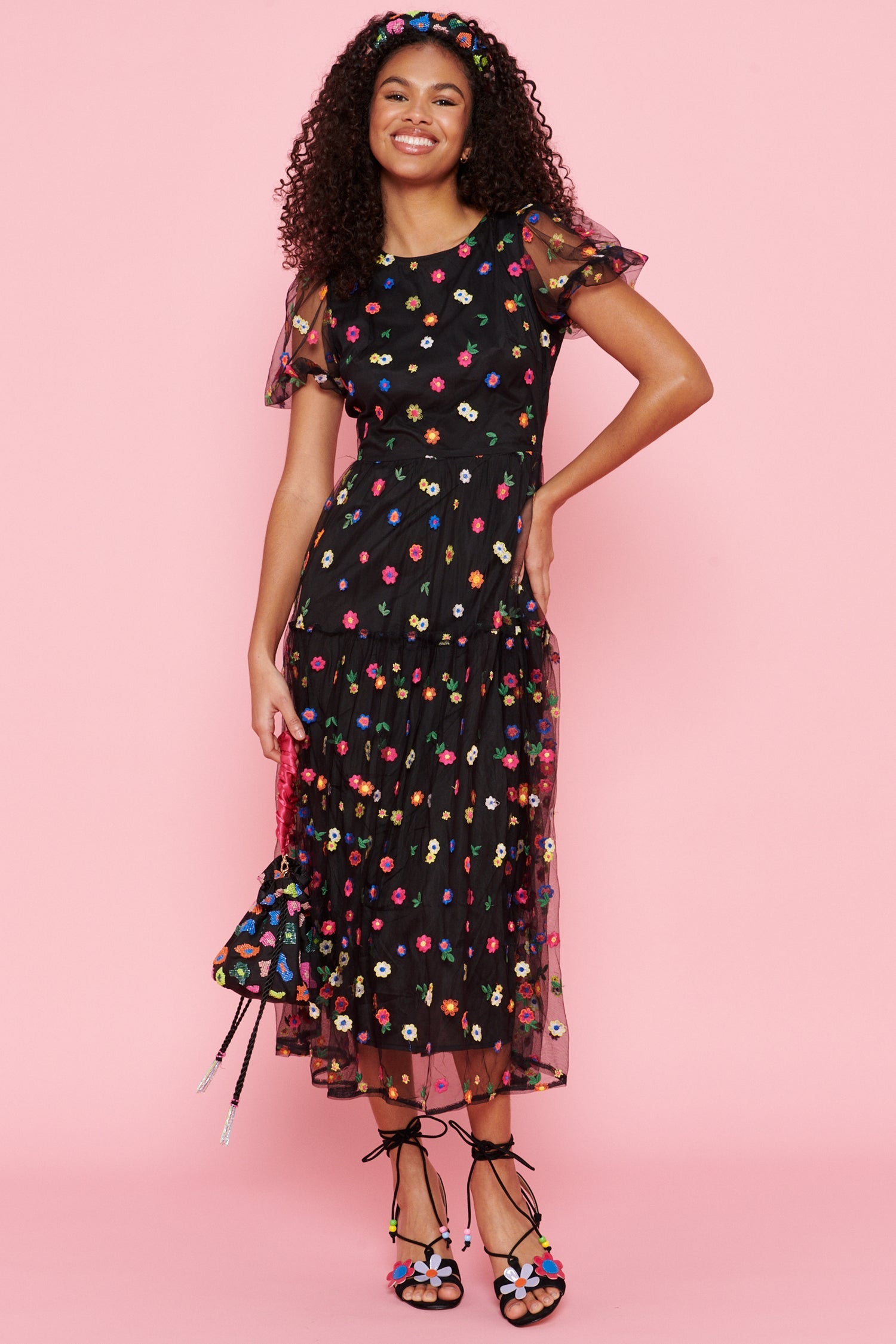 Model wearing Black Flower Abigail facing the camera