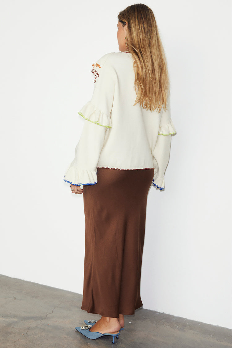 caption_Model wears  Cream Austin Cardigan in UK size 10/ US 6