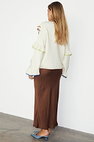 Thumbnail for caption_Model wears  Cream Austin Cardigan in UK size 10/ US 6