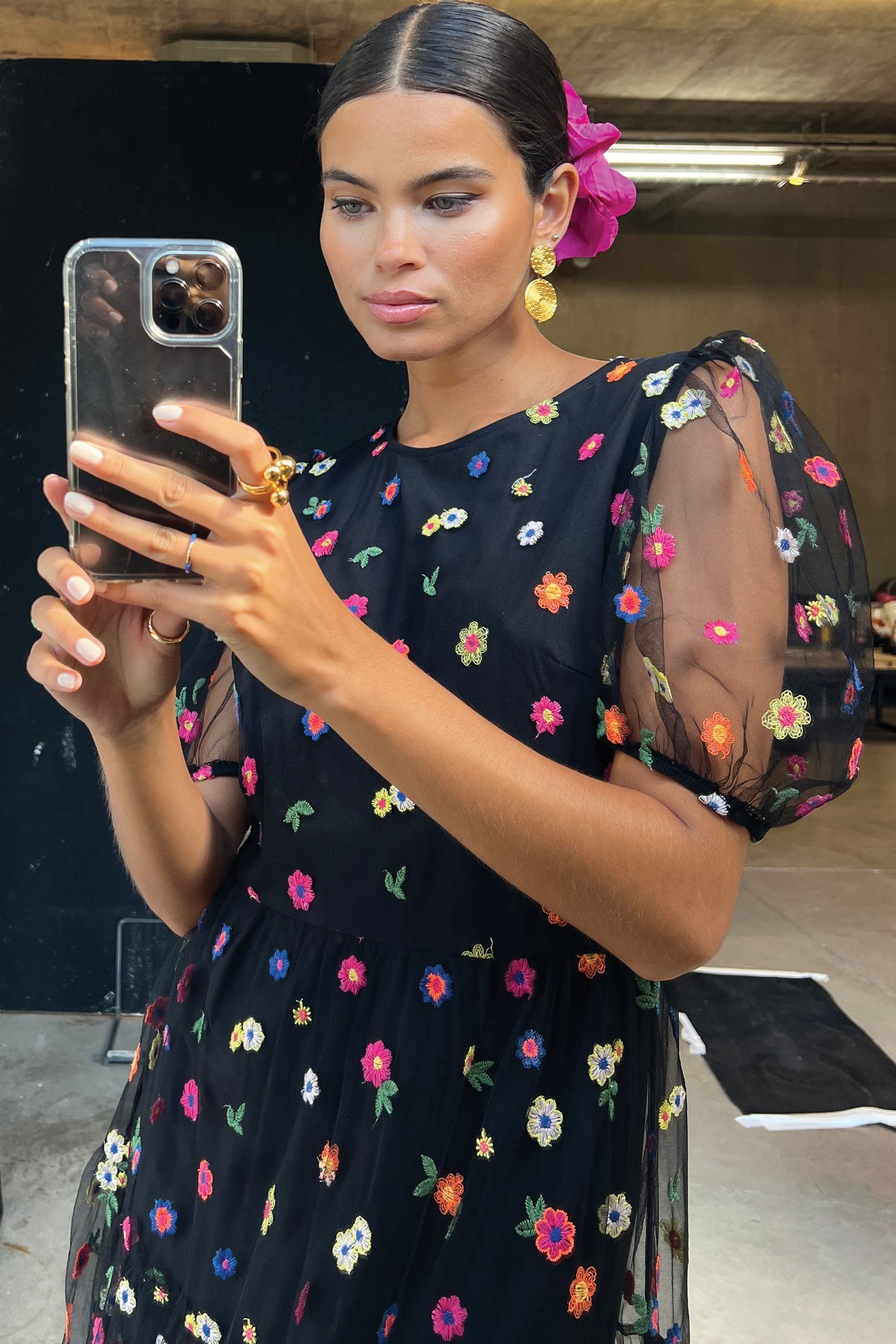 Model wearing Black Flower Abigail Dress facing the camera