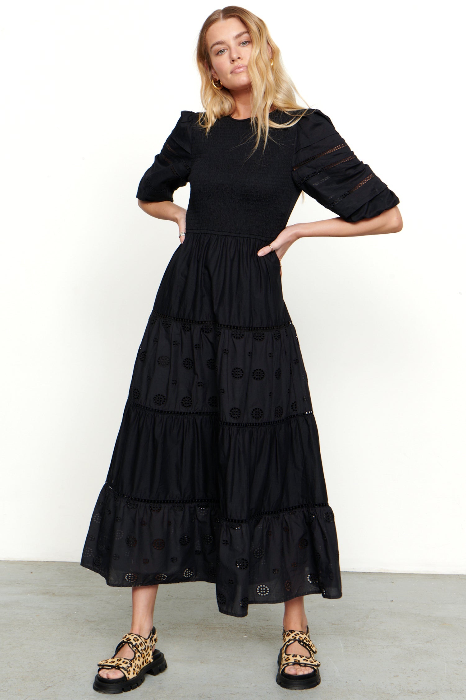 Model wearing Black Broderie Smock Dress standing facing the camera 