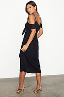 Thumbnail for caption_Model wears Black Cassie Dress in UK size 10/ US 6