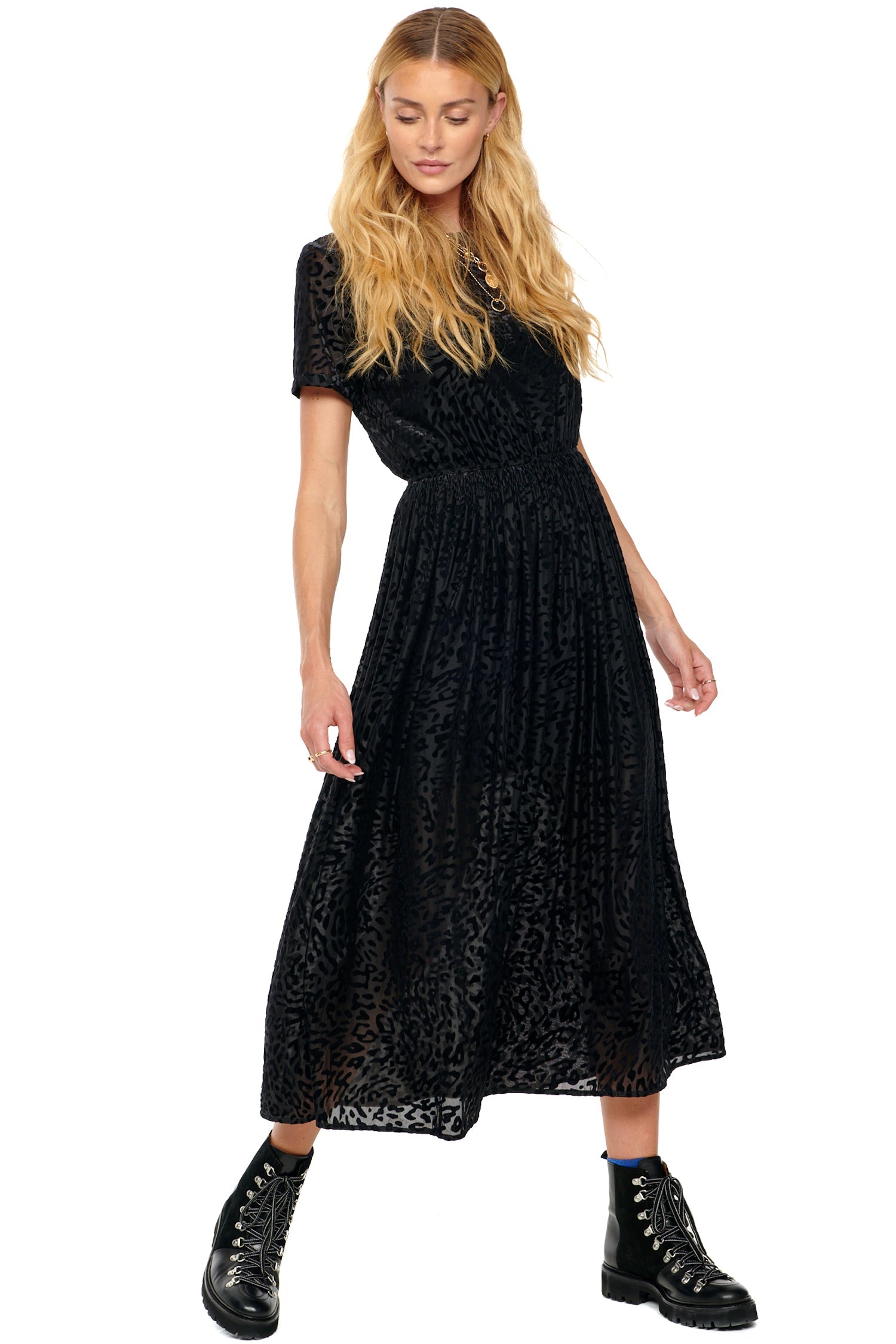 Model wearing Black Animal Devoree Dress standing facing the camera