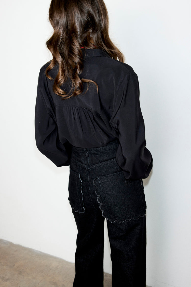 caption_Model wears Black Scallop Detail Jeans in UK size 10/ US 6