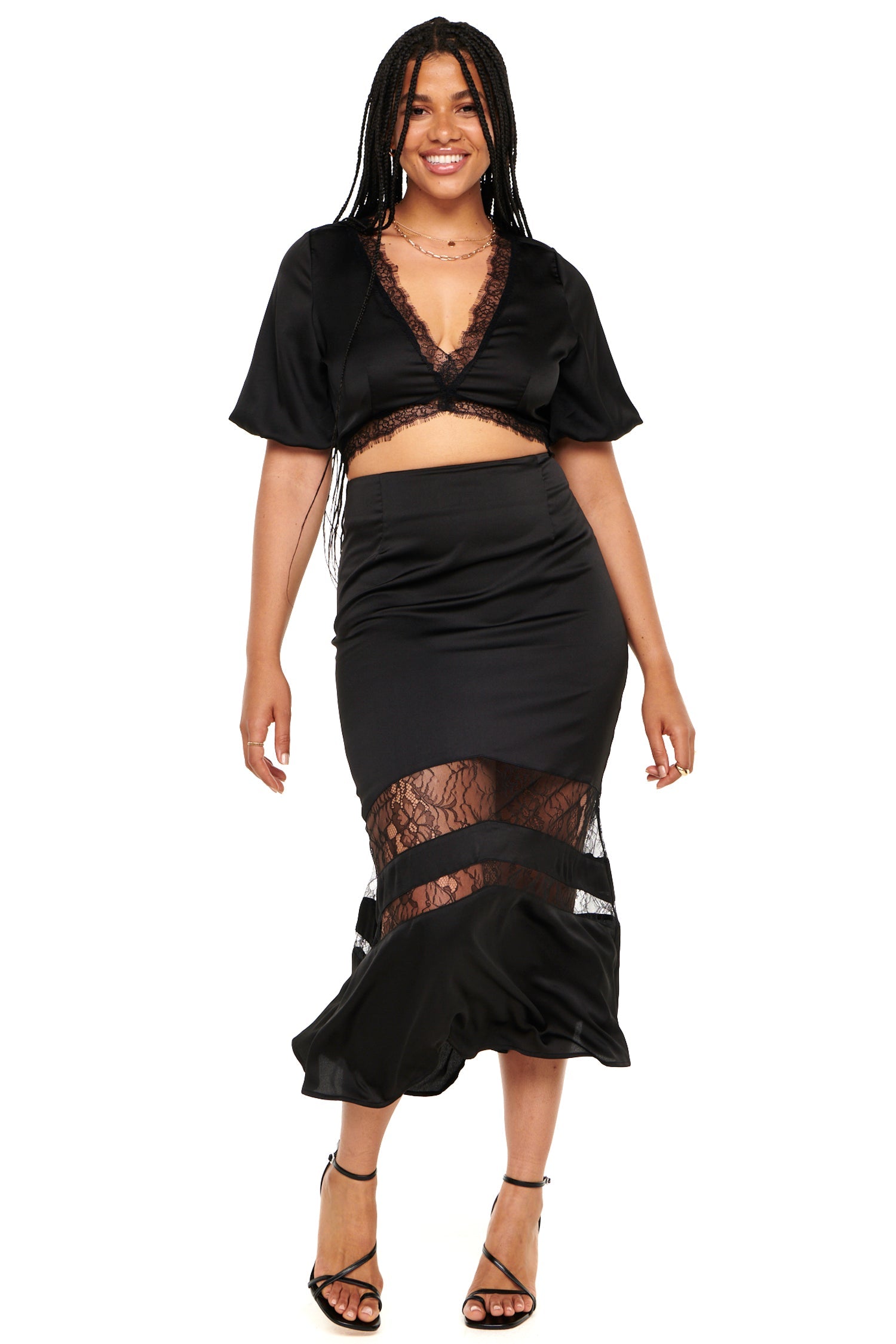 Model wearing Black Lace Crop Top standing facing the camera