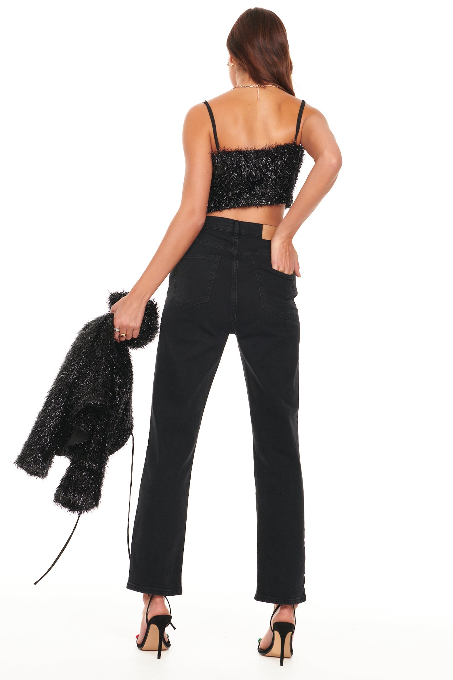 Model wearing Black Sparkle Crop Top standing facing away from the camera 