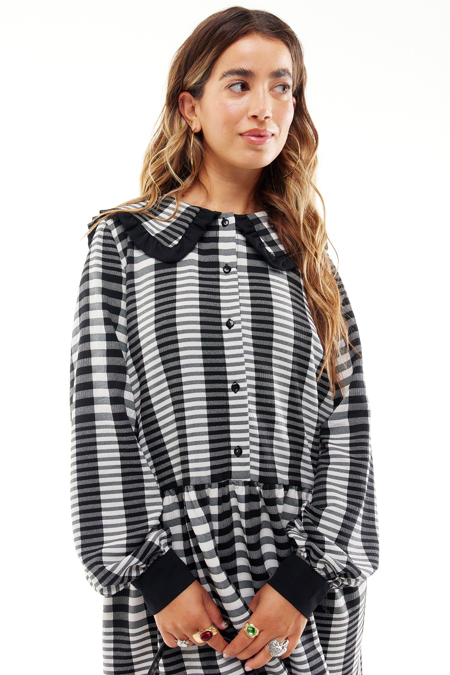 Model wearing Check Mini Molly Dress standing facing the camera