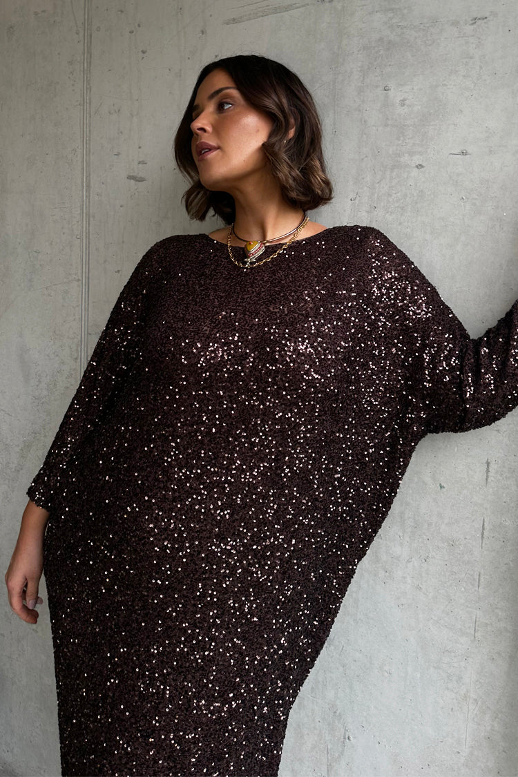 caption_Model wears Chocolate Sequin Jem Dress in UK size 18/ US 14