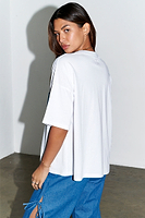 Thumbnail for caption_Model wears  White Denim Pocket T-shirt in UK size 10/ US 6